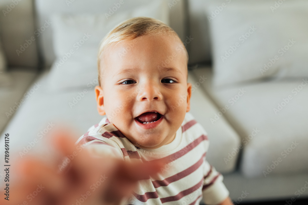 Toddler reaching camera Toddler reaching camera
