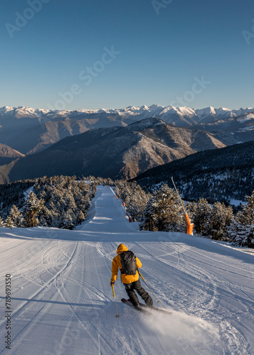 Man doing ski touring at sunrise photo