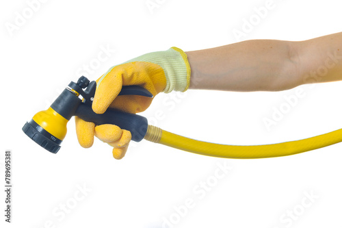 Woman's arm with garden hose sprayer © Eric Hood