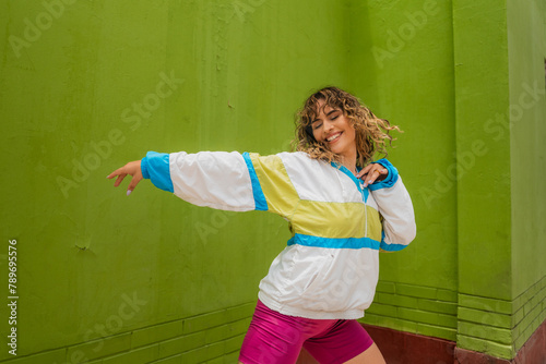 Happy Woman Dancing to the Music photo