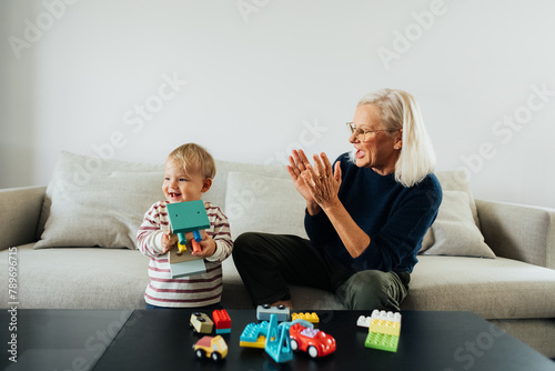 Grandmother playing with her grandson  photo