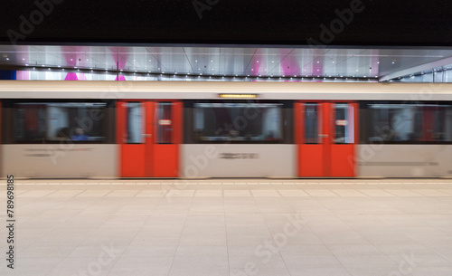 metro departing from platform photo