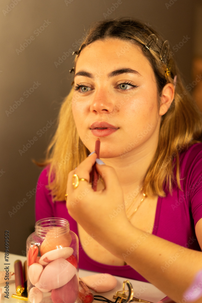 Makeup Mastery: Teen Applying Lipstick Makeup Mastery: Teen Applying Lipstick