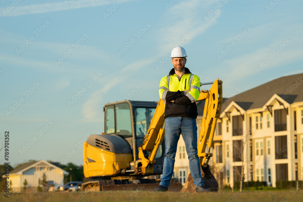 Worker man, small business owner. Construction worker with hardhat helmet on construction site. Construction engineer worker in builder uniform with excavation digging. Worker construction.
