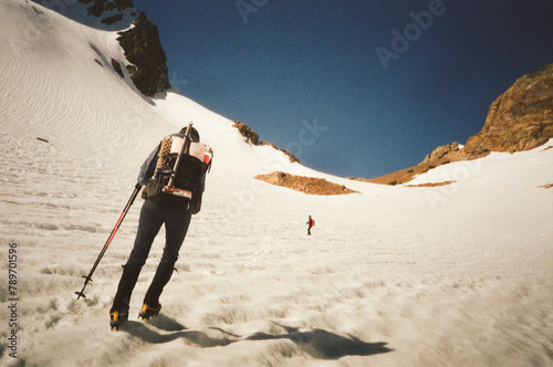 Hiking with crampons in snow photo