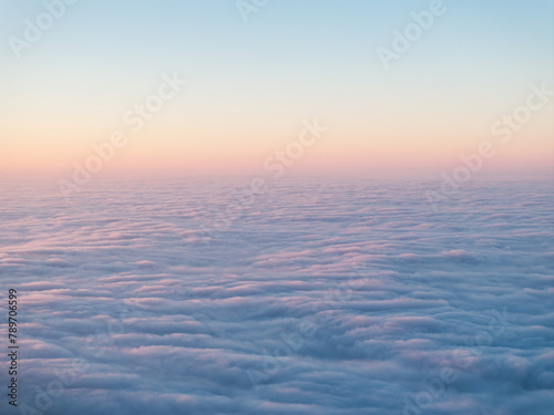 Sunset above rolling fog / clouds photo
