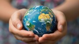 Hands holding a globe with care and affection, promoting the idea of global stewardship