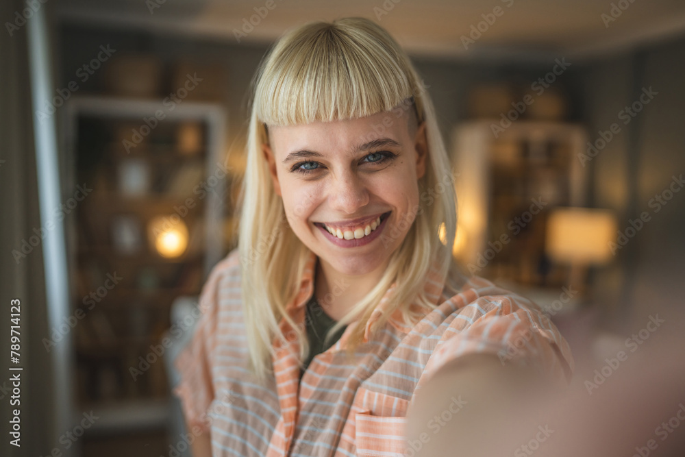 Young beautiful woman do selfie picture at home smile happy Young beautiful woman do selfie picture at home smile happy