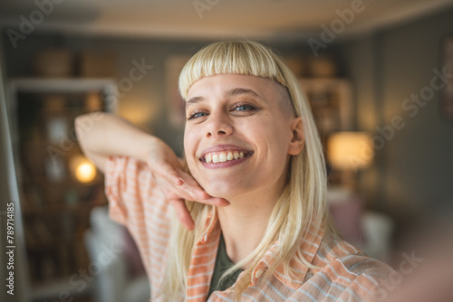 Canvas-taulu Young beautiful woman do selfie picture at home smile happy