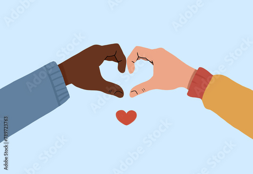 Two hands of different skin tones create a heart shape photo