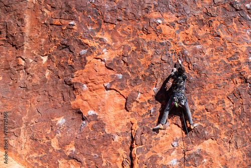 Rock climber outside clipping 