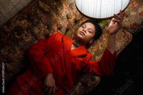 A woman is lying on the couch
