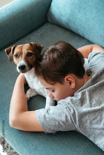 Kid sleeping together with pet.