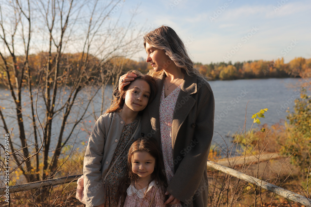 mother with daughters in the park