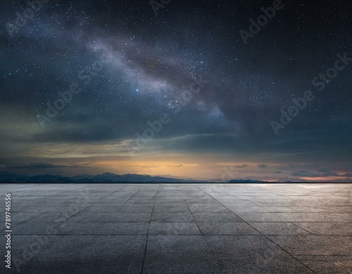 Empty asphalt floor with night sky .