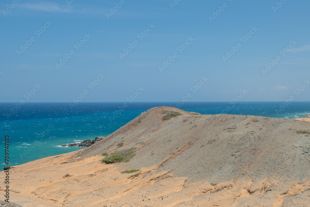 hermosos paisajes del cabo de la vela, en uribia,la guajira colombia. estos lugares son especiales para descansar, vacacionar, recorrer nuestro pais, por su belleza, en medio del desierto y el mat. hermosos paisajes del cabo de la vela, en uribia,la guajira colombia. estos lugares son especiales para descansar, vacacionar, recorrer nuestro pais, por su belleza, en medio del desierto y el mat.