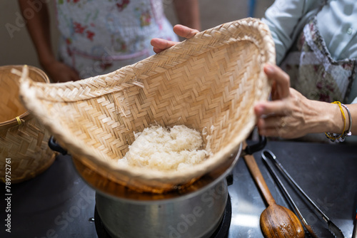 Sticky rice steaming in bamboo. photo