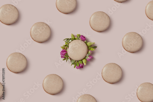 Homemade macaron filled with spring flowers among other tasty ones photo