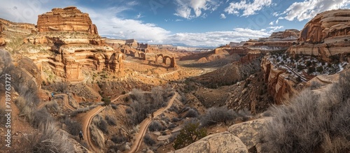 AweInspiring Hike Through Canyon Trails Towering Rock Formations and Natural Arches photo