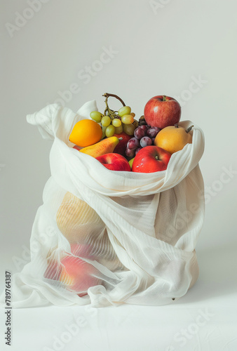 **a white cloth bag filled with fruit on a white background, in the style of infinity nets, uhd image, pentax k1000 .  photo