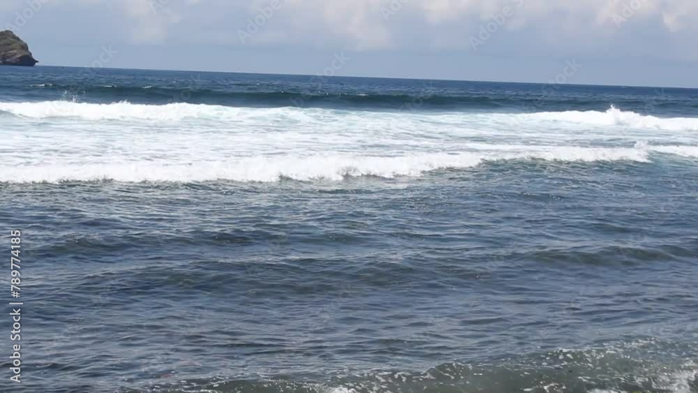 White water waves above the surface of the turquoise sea are beautiful and clean White water waves above the surface of the turquoise sea are beautiful and clean
