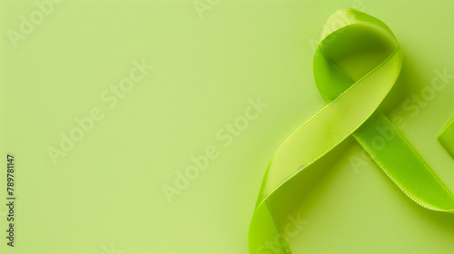 Flatlay lime green cancer ribbon blank background lymphoma, non-hodgkin lyme disease duchenne muscular duchenne dystrophy mitochondrial support awareness fundraising survivor copy space photo