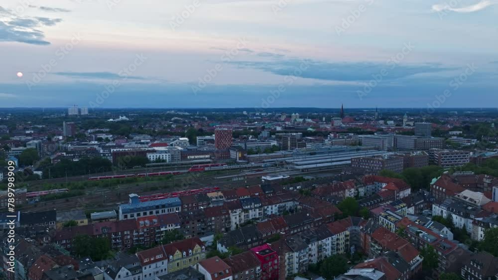 An aerial drone view of the old city ( Altstadt ) of Münster , Germany at sunset . An aerial drone view of the old city ( Altstadt ) of Münster , Germany at sunset .