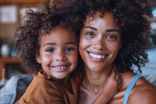 Happy Afro mother and daughter having fun together, love and family