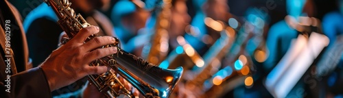 A musician playing the saxophone in a jazz band. photo