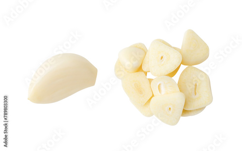 Top view set of peeled garlic cloves and slices or pieces in stack isolated with clipping path in png file format