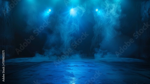 Blue spotlights illuminate an empty stage with fog on the floor. © Sittipol 