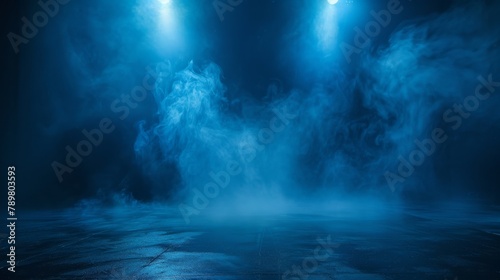 Blue spotlights illuminate the empty stage.