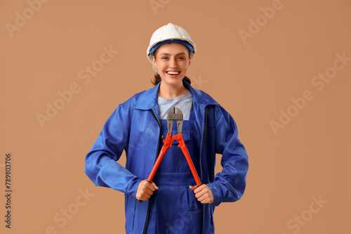 Female worker with pliers o...