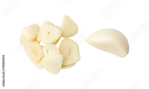 Top view set of peeled garlic cloves and slices or pieces in stack isolated on white background with clipping path