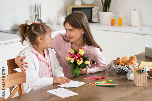 Cute daughter greeting her ...