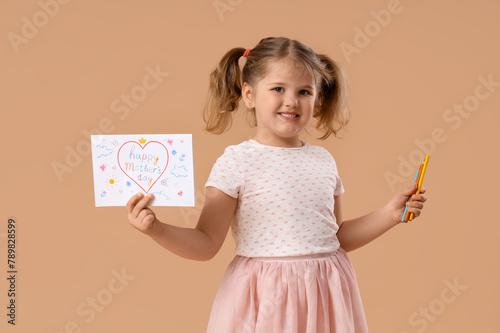 Little girl holding pencil ...