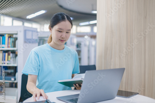 girl student study online with teacher, happy young woman with internet learning in library, distance education