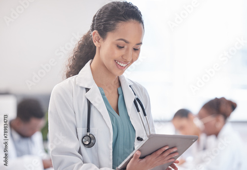 Happy woman, doctor and research with tablet for browsing, news or medical information at hospital. Female person or healthcare employee with smile on technology for Telehealth or online discovery