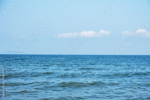 Scenic view of sea against blue sky during summer