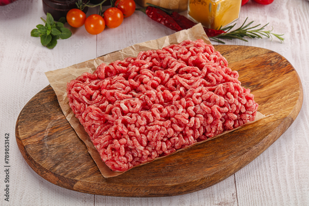 Raw minced beef meat over board Raw minced beef meat over board