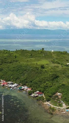 Fishing village on a tropical island. Diutay Island. Philippines. photo