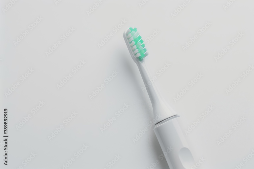 Modern Electric Toothbrush with Mint Green Bristles on a Clean White Background Modern Electric Toothbrush with Mint Green Bristles on a Clean White Background