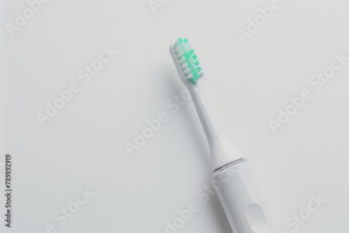 Modern Electric Toothbrush with Mint Green Bristles on a Clean White Background