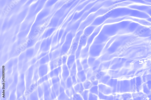 Purple water bubbles on the surface ripples. Defocus blurred transparent pink colored clear calm water surface texture with splash and bubbles. Water waves with shining pattern texture background