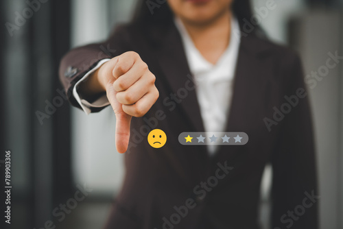 A professional businesswoman giving a thumbs down with a one-star rating, symbolizing poor service or customer dissatisfaction.