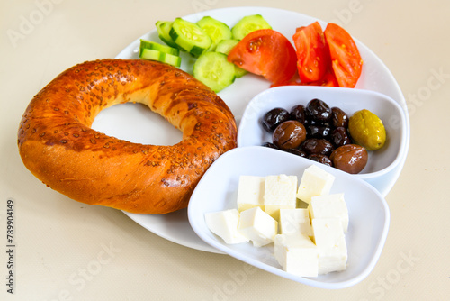 Turkish pastry product , tasty pogaca. Simit, gevrek. Turkish Pastries; peynirli, patatesli, kasarli pogaca, borek, acma, ay coregi at patisserie showcase. photo