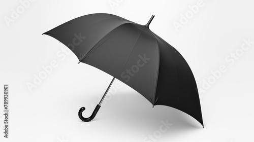 Black umbrella in tilted position on white background