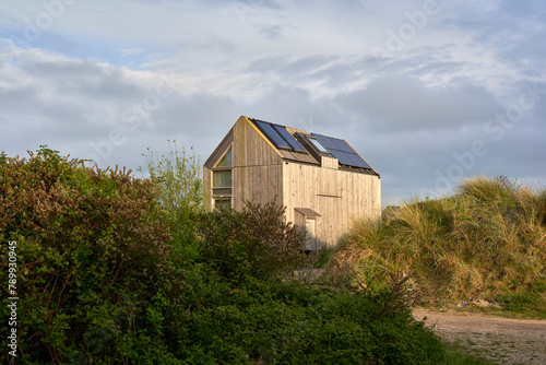 Environmentally friendly eco house with solar cells and photovoltaic. Sustainable vacation home in nature. Holland, Zeeland.