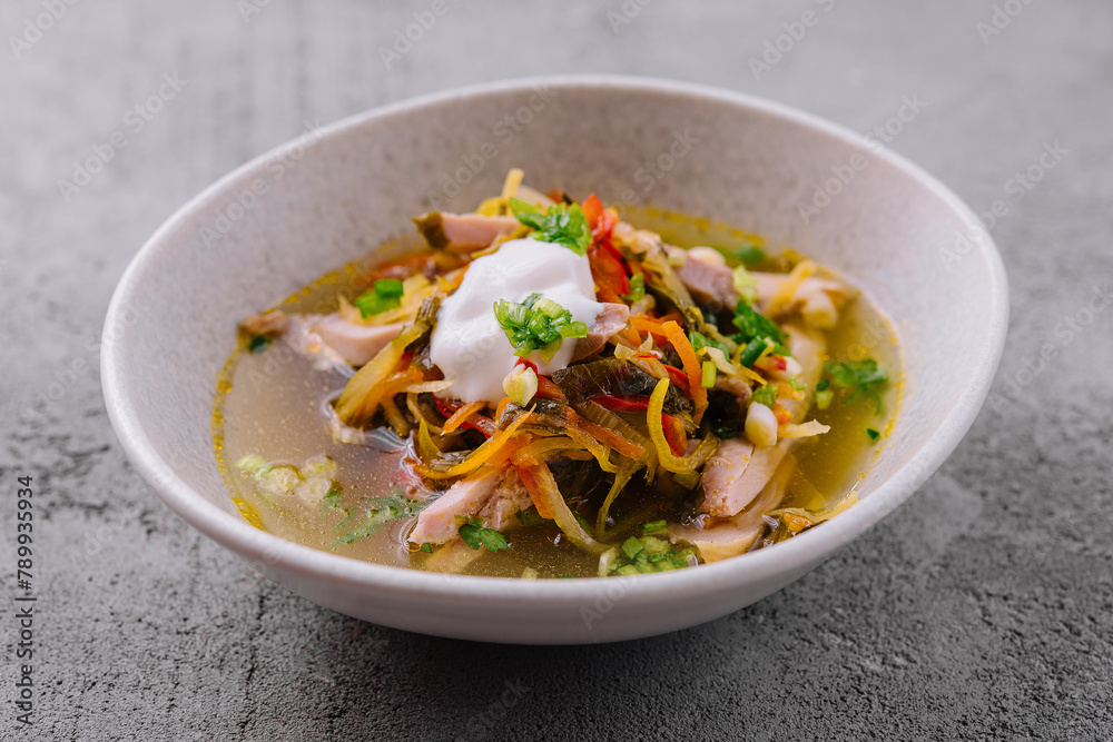 Traditional mexican sopa azteca in a white bowl Traditional mexican sopa azteca in a white bowl