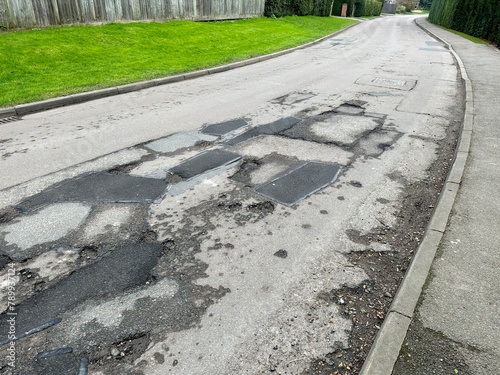 Village road in South Cambridgeshire full of pot holes

